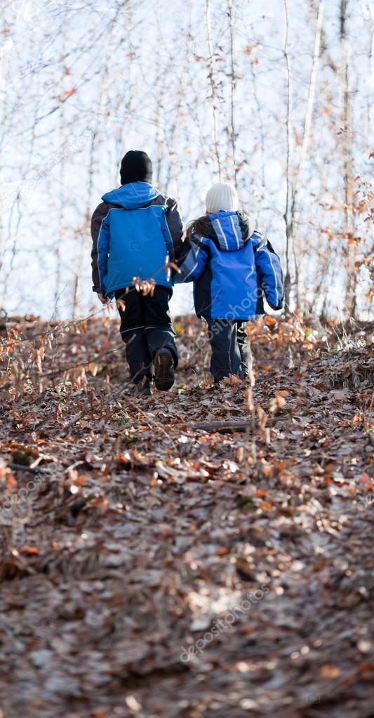 Children walking in a forest