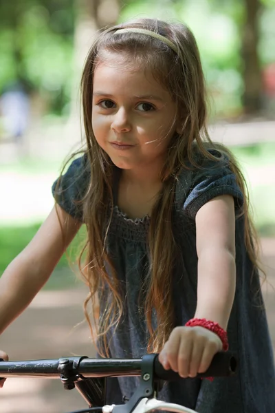 Little girl riding bicycle — Stock Photo, Image