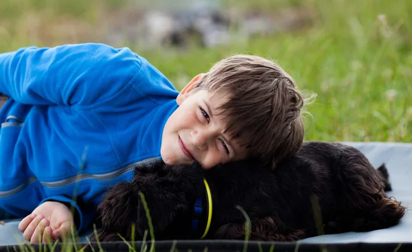 Young boy with dog — Stock Photo, Image
