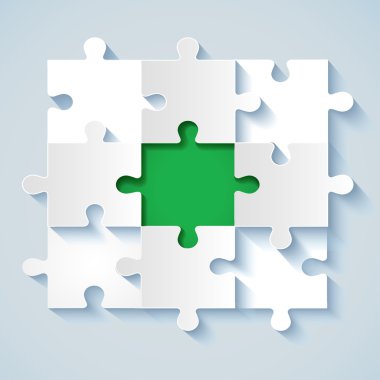 Paper puzzle with green the middle for business concepts