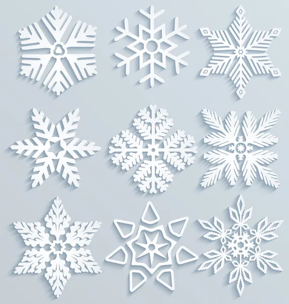 Снежные украшения. Набор бумажных снежинок — стоковый вектор