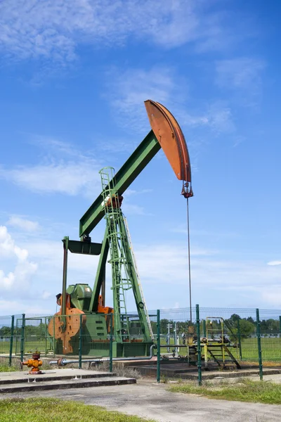 Oil pump jack in work. Oil industry in Seria, Brunei Darussalam — Stock Photo, Image
