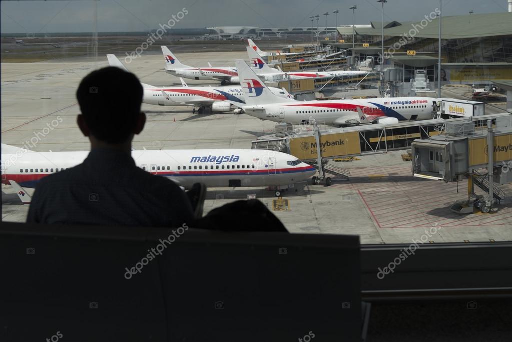 KUALA LUMPUR INTERNATIONAL AIRPORT - MARCH 17: Malaysia Airlines planes prepare for passengers to board, as ground crew prepares the plane for the flight on March 17, 2014 in KLIA, Sepang, Malaysia.