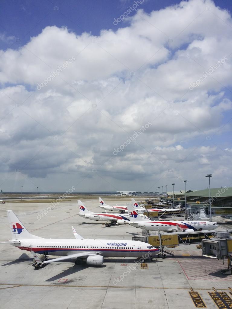 KUALA LUMPUR INTERNATIONAL AIRPORT - MARCH 17: Malaysia Airlines planes prepare for passengers to board, as ground crew prepares the plane for the flight on March 17, 2014 in KLIA, Sepang, Malaysia.