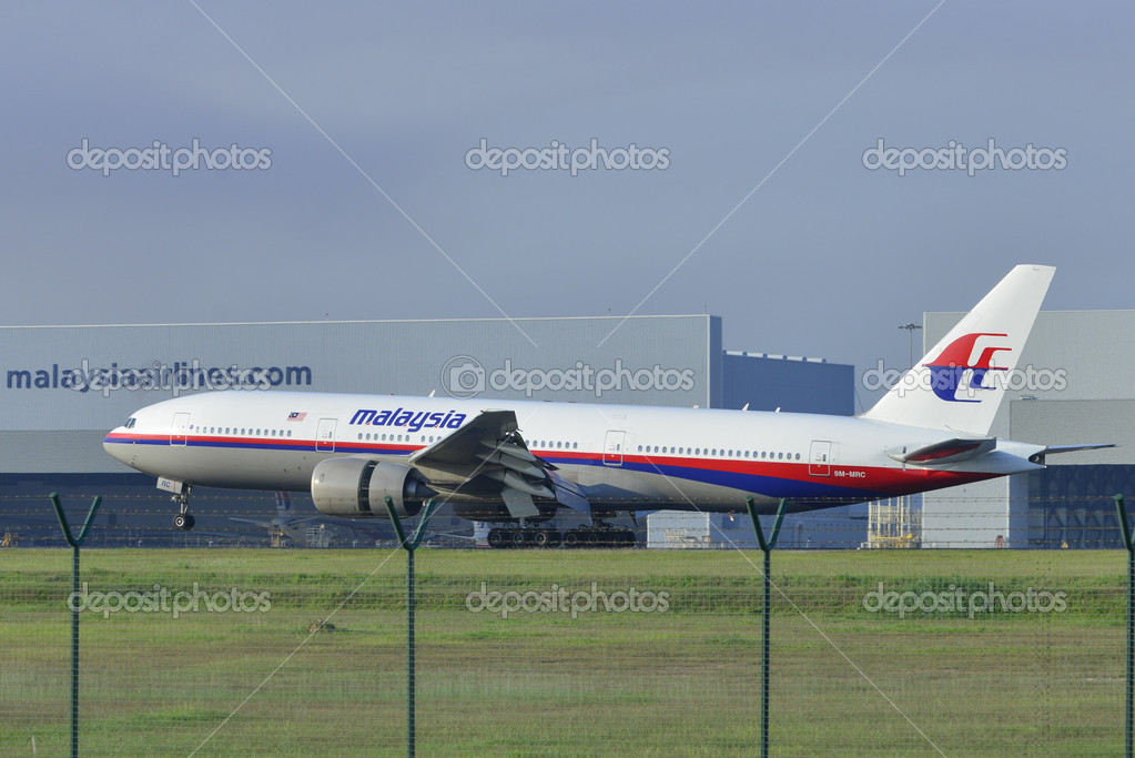 KUALA LUMPUR INTERNATIONAL AIRPORT (KLIA), SEPANG, MALAYSIA- JULY 19: Boeing 777-200ER (9M-MRC) Malaysia Airlines lands at KLIA on July 19, 2014 in KLIA, Sepang, Malaysia.