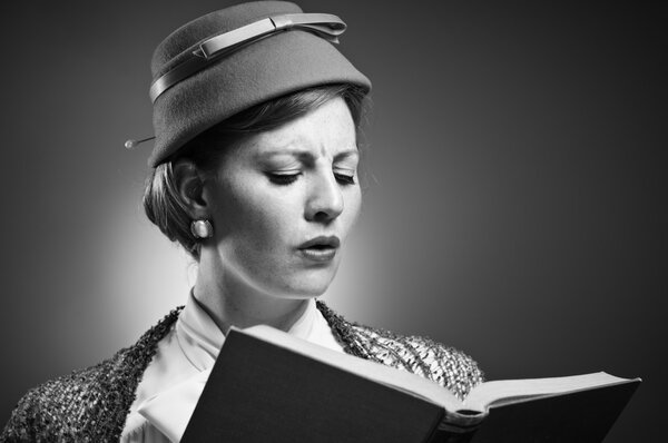 Retro Styled Woman Reading A Book