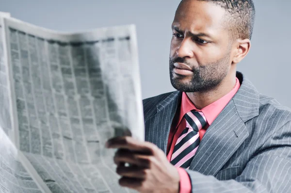 Young African American Businessman Reading Newspaper — Stock Photo, Image