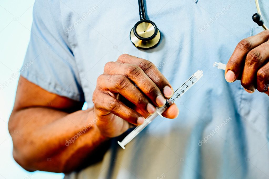 Doctor Connecting Blunt Tip Syringe To An IV