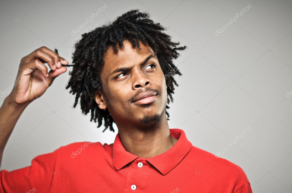 Young Man Twists His Hair While Plotting Stock Photo C Camrocker