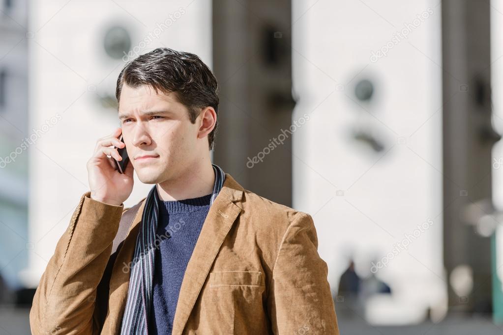 Man Talking On Cellphone At The Station