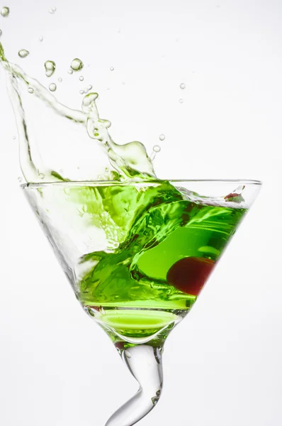 Apple martini with maraschino cherry drop — Stock Photo, Image