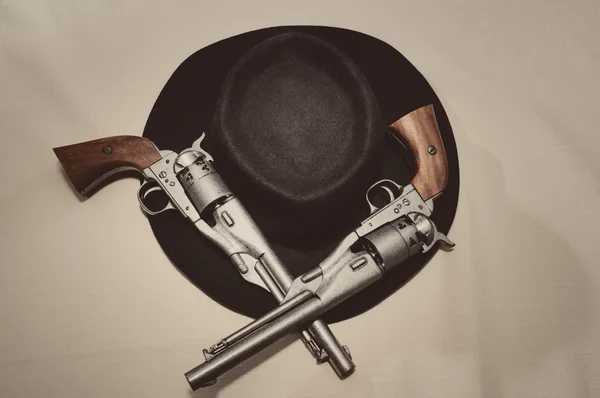 Hat and guns — Stock Photo, Image