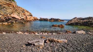 Rocks and sea in long exposure in Menorca island, Spain