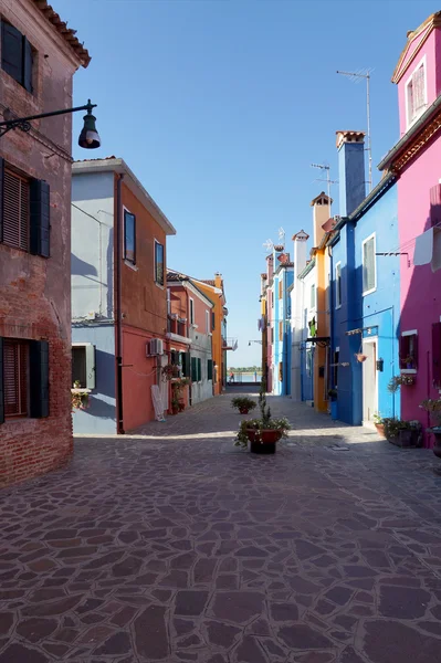 Colored facade of the island of Burano in the background of blue — Stock Photo, Image