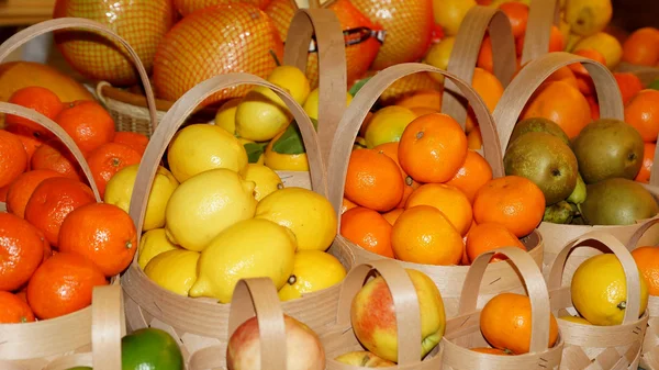 Juicy and ripe fruit in baskets — Stock Photo, Image