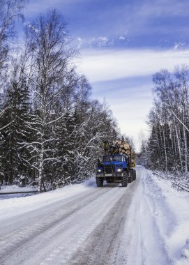 timber transport on the winter road clipart