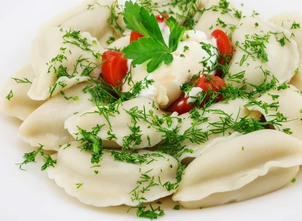 Dumplings with sour cream — Stock Photo, Image