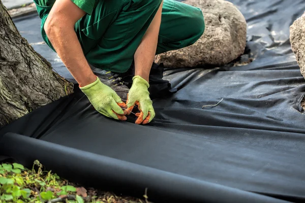 Weed barrier sheet installation — Stock Photo, Image