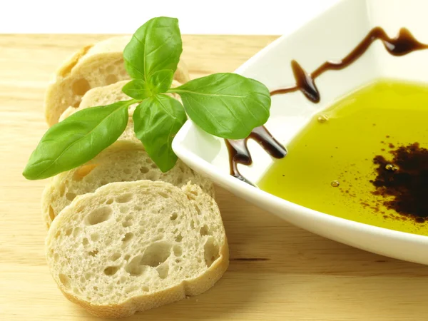 Baguette and oil — Stock Photo, Image