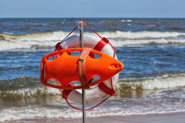 Lifebuoy at seaside clipart