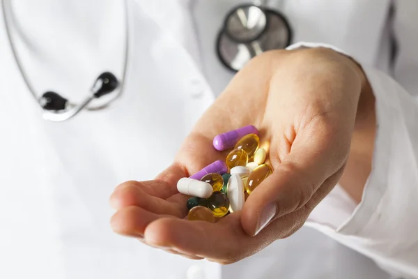 Physician's hand with drugs — Stock Photo, Image