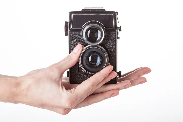 Φωτογραφική μηχανή που λειτουργεί σε άσπρο φόντο απομονωμένες — Φωτογραφία Αρχείου