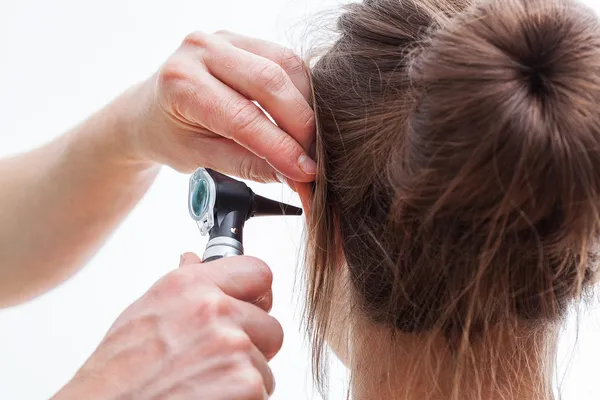 Ear examining, isolated — Stock Photo, Image