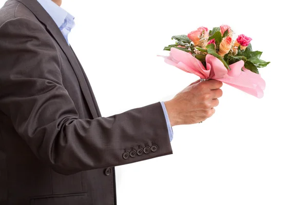 Hombre con flores en una cita — Foto de Stock