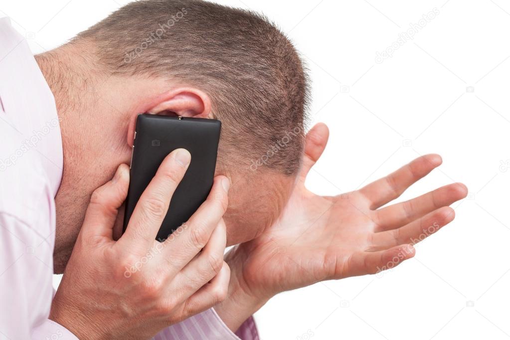 Frustrated man talking on the phone