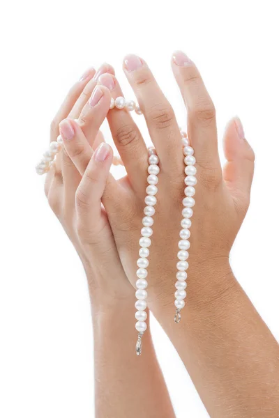 Woman's hands with a pearl — Stock Photo, Image