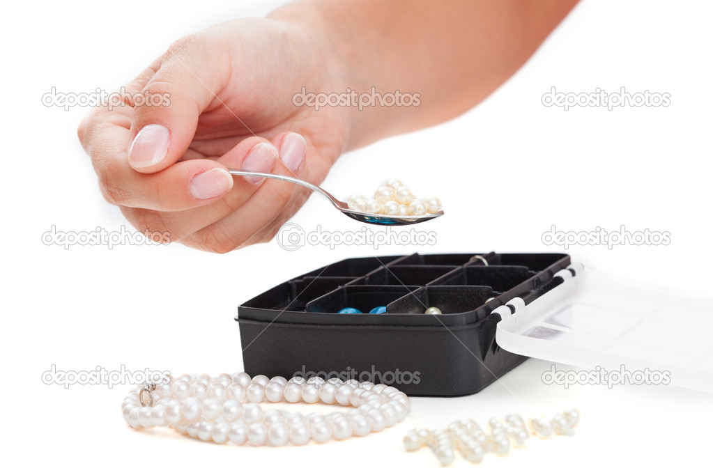 Girl preparing pearls for handmade jewellery