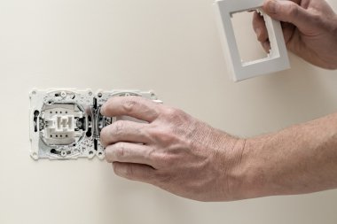 Finishing new house, light switch clipart