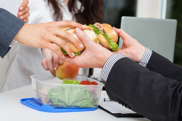 Sharing lunch in the office — Stock Photo, Image