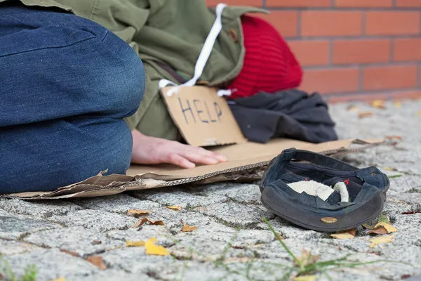 Beggar falling asleep on the street — Stock Photo, Image