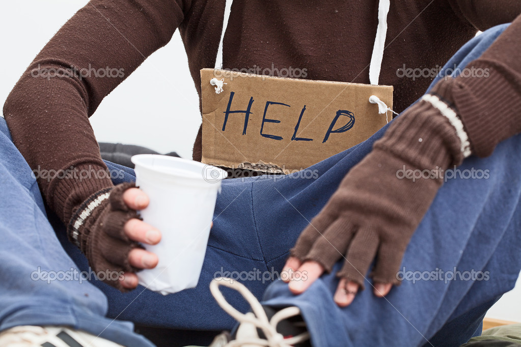 Male homeless with sign