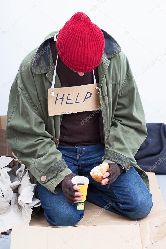 Homeless eating his meal