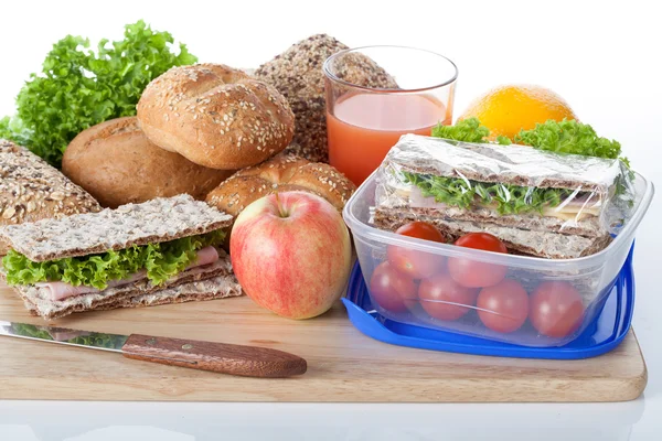 Fresh crunchy bread and lunch box — Stock Photo, Image