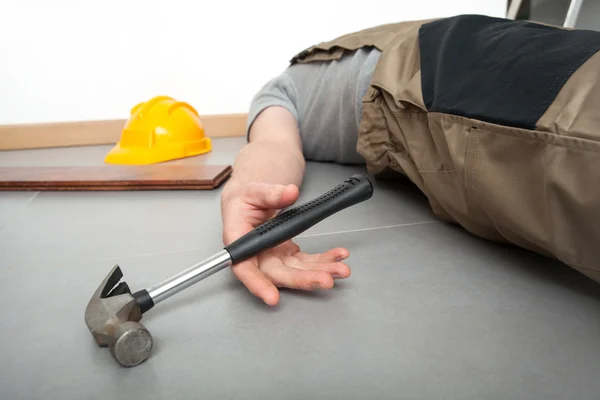 Unconscious worker — Stock Photo, Image