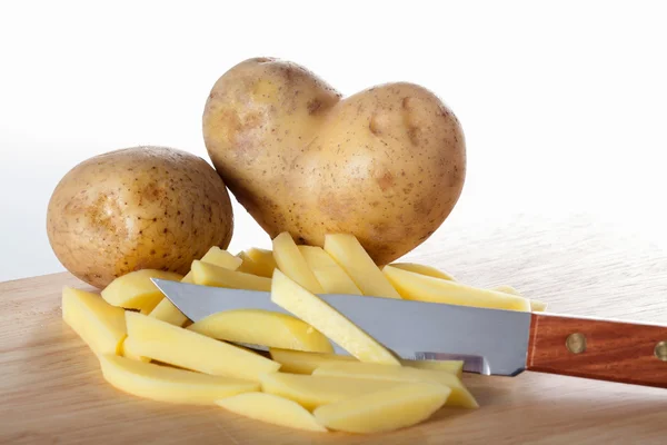 Fries on cutting board — Stock Photo, Image