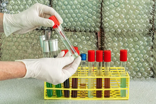 Chemist showing test tube — Stock Photo, Image