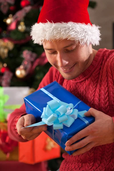 Man in santa's hat just got the present — Stock Photo, Image