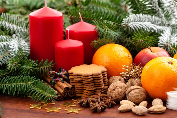 Candles, fruits, cookies and nuts — Stock Photo, Image