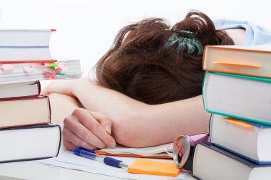 Tired student falling asleep during learning clipart