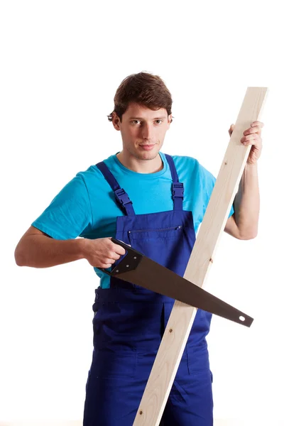 Carpenter with a wood saw — Stock Photo, Image