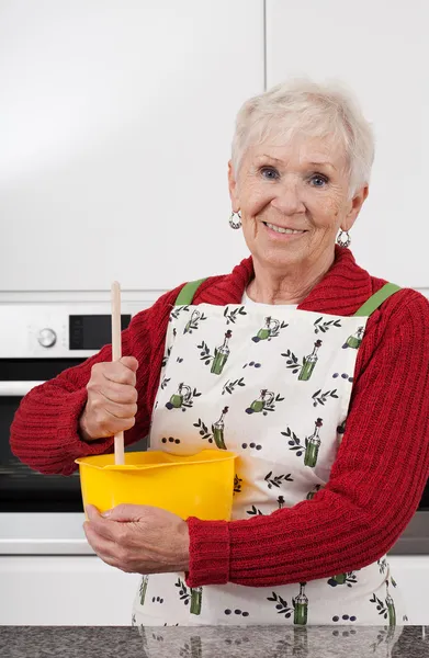 Grandma baking cake — Stock Photo, Image