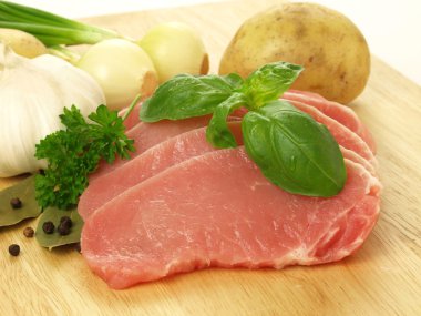 Raw pork with vegetables clipart