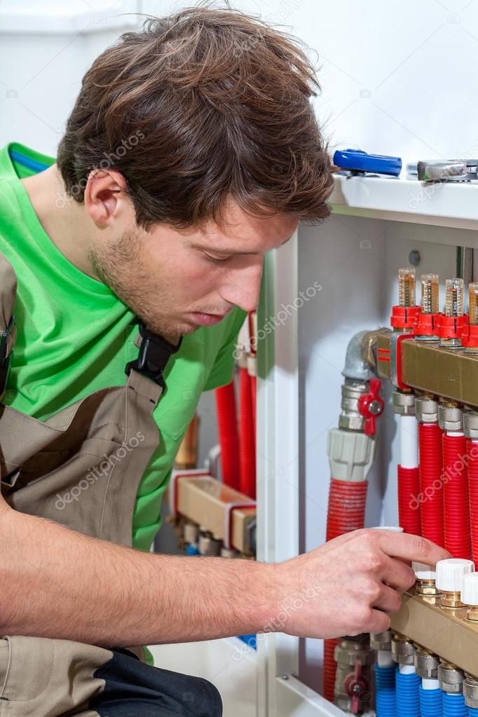 Plumber fixing the valves