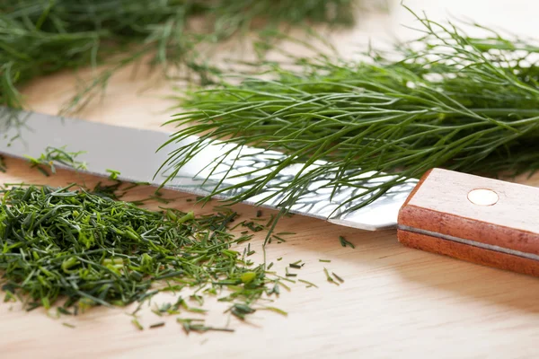 Cut dill and knife — Stock Photo, Image