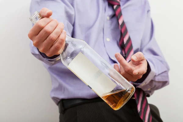 Businessman offering alcohol — Stock Photo, Image