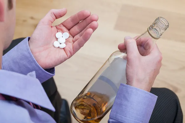 Drunk man taking drugs. — Stock Photo, Image